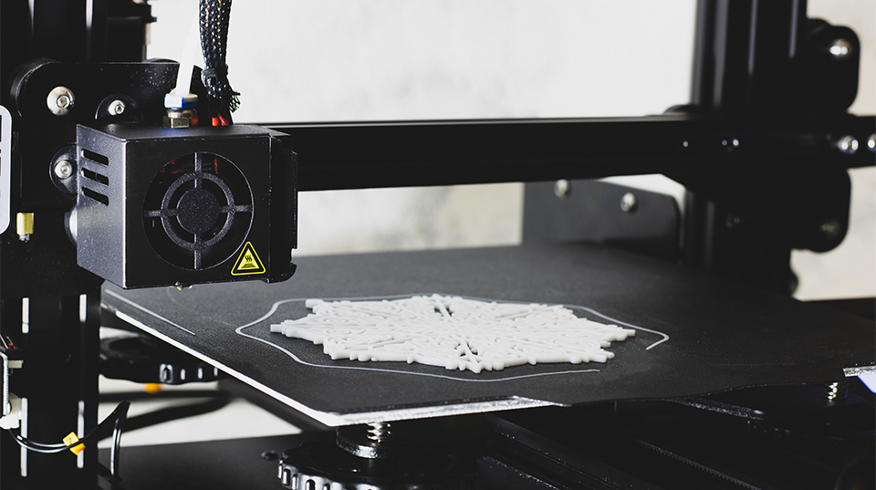 Industrial 3D printer producing a prototype part for rapid product development and engineering validation.